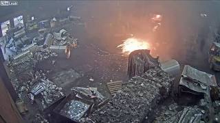 Foundry worker puts wet scrap metal in furnace [upl. by Seena]